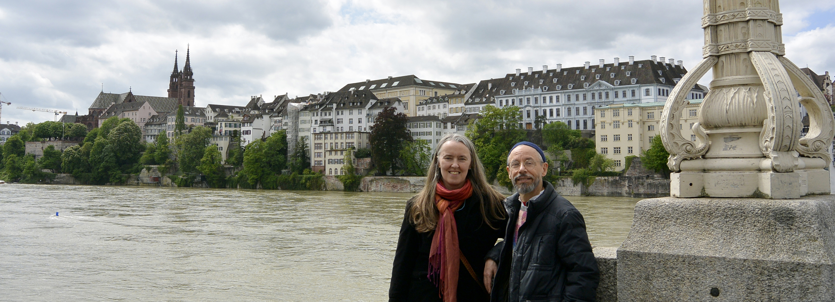 Image of Jutta and Terran standing along the Rhein River in Basel, Switzerland.